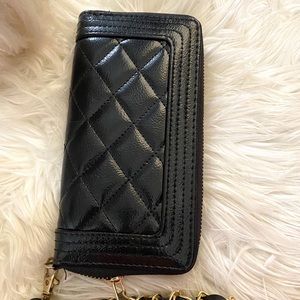 Black quilted wallet.